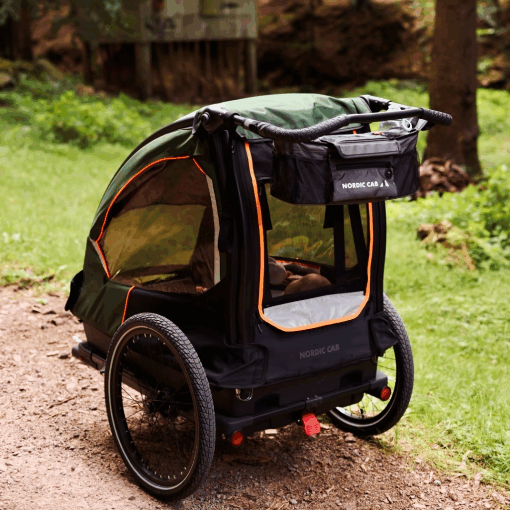 Rear view of Nordic Cab bike trailer showing storage space and handlebar.
