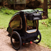 Rear view of Nordic Cab bike trailer showing storage space and handlebar.