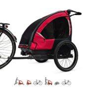 Nordic Cab Explorer 4-in-1 Solid Red used as a bike trailer attached to an e-bike, showing stroller, jogger, and cargo functions.