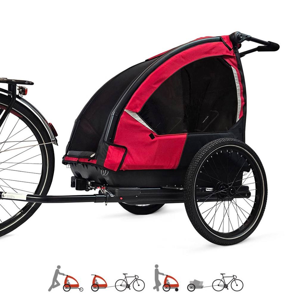 Nordic Cab Explorer 4-in-1 Solid Red used as a bike trailer attached to an e-bike, showing stroller, jogger, and cargo functions.