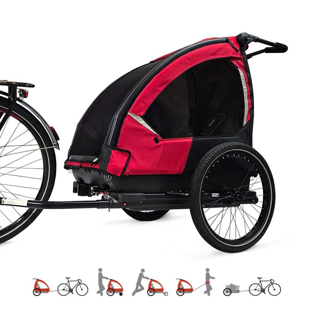Nordic Cab Explorer 5-in-1 Solid Red attached to a bike – showing all five functions: bike trailer, stroller, jogger, hiking trailer, and cargo mode.